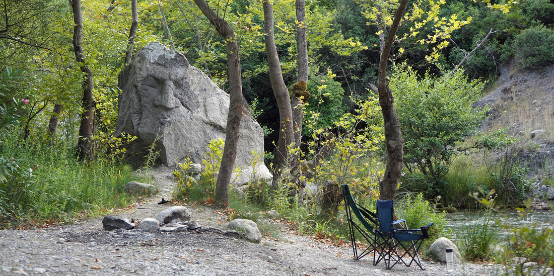 camping spot in gorgopotamos with carved stone art
